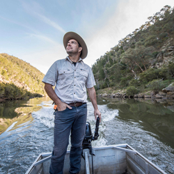 Phil Palmer boating down river on Scottsdale Reserve