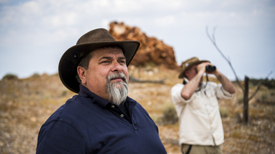 Bush Heritage staff Bruce Hammond and Graeme Finlayson look out at Evelyn Downs.