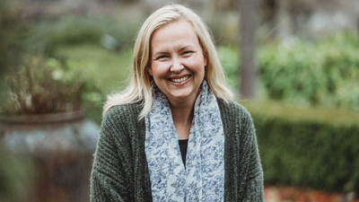 Bush Heritage CEO Rachel Lowry, a smiling, middle-aged woman with shoulder-length blonde hair.