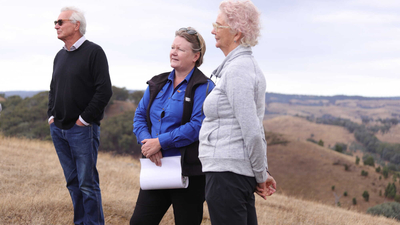 Bush Heritage CEO Heather Campbell stands between Bush Heritage President Sue O’Connor and Board member Nicholas Burton Taylor at The Round House Reserve.