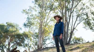 Brenda Duffy, Healthy Landscapes Manager New South Wales, looks out over a revegetated habitat
corridor connecting two parcels of land we protect at Tarcutta Hills, New South Wales. By Grassland Films