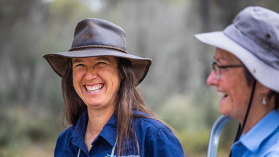 Ecologists Michelle Hall and Angela Sanders share a laugh in the field.