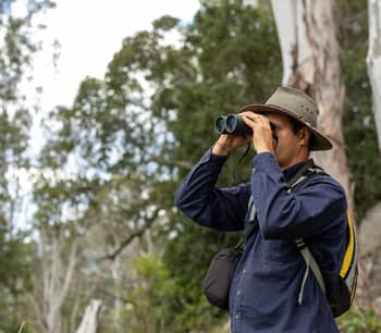 Joshua Wellington with binoculars.
