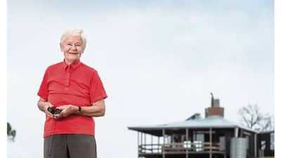 The front cover of Bushtracks Autumn 2021 newsletter shows Bush Heritage supporter Annelie Holden on the property she has gifted to Bush Heritage.