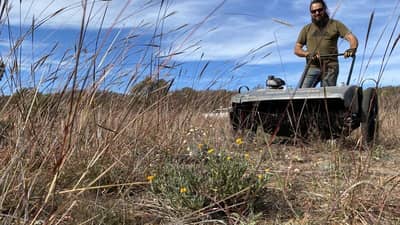 Phil Palmer operating a Grass Grabber.