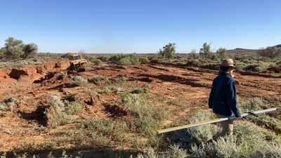Janet Walton taking levels to ensure the land lies flat.