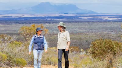 Bush Heritage ecologist Angela Sanders and Healthy Landscape Manager Simon Smale, with the Stirling Ranges in the background. Photo by William Marwick.
