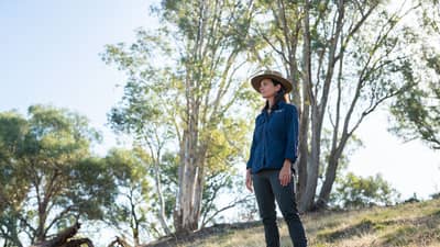 Brenda Duffy, Healthy Landscapes Manager New South Wales, looks out over a revegetated habitat
corridor connecting two parcels of land we protect at Tarcutta Hills, New South Wales. By Grassland Films