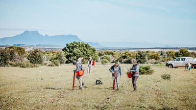 Volunteers planting native trees and shrubs at Monjebup Reserve in south-west WA.