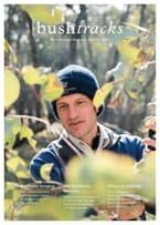 Dr Matt Appleby inspecting eucalypt leaves on the cover of Bushtracks Spring 2018.