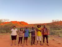 Six Birriliburu Rangers, four Aboriginal men and two Aboriginal women, at Katjarra in central WA.