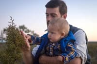 Bush Heritage ecologist Ben Parkhurst and his 10-month-old son Liam on Eurardy Reserve, WA.