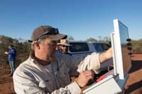 Ecologist Graeme Finlayson setting up an acoustic monitor. Photo Amelia Caddy.
