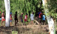 School children walk on country during a Waanyi Garawa culture and biodiversity camp in 2020. Photo by Carmen Taylor.