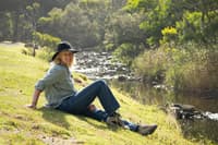 Rachel Lowry below the cliffs at Cumberland River on Gadubanud Country, VIC. Photo: Coco McYork