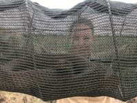 Dr Pippa Kern presents a snake in a funnel.