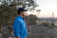 Alex Hams looks out over cleared land adjacent our reserves.