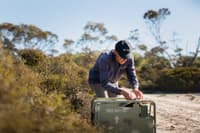 Jeff Pinder with a Felixer cat trap at our Red Moort Reserve.