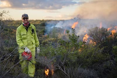 Alex Hamms conducts controlled burn at Chereninup Creek.