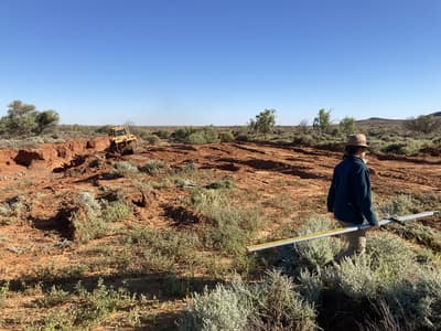 Janet Walton taking levels to ensure the land lies flat.