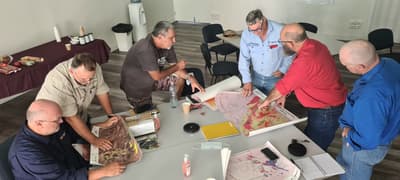 Fire management team consult maps and plan work.