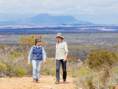 Bush Heritage ecologist Angela Sanders and Healthy Landscape Manager Simon Smale, with the Stirling Ranges in the background. Photo by William Marwick.