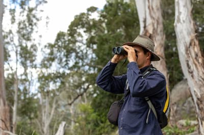 Joshua Wellington with binoculars.