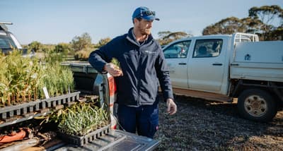 Alex Hams with seedlings for revegetation work.