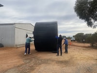 On a roll and moving the repaired bore tank.
