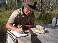 Volunteer Jet Jensen records Siam stats.