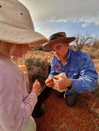 Graeme showing Isla a skink.