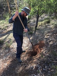 Collecting soil in the field.
