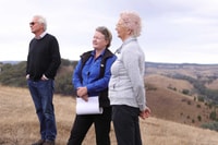 Bush Heritage CEO Heather Campbell stands between Bush Heritage President Sue O’Connor and Board member Nicholas Burton Taylor at The Round House Reserve.