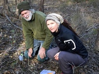 Geoff Neville and Julie Radford replanting orchids at J.C. Griffin Reserve.