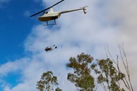 Helicopter conducting wet season burn. Photo Martin Willis.