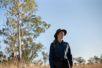 Reserve Manager Becky Miller in a field of Bluegrass.