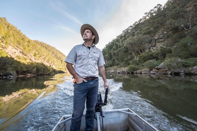 Phil Palmer boating down river on Scotsdale Reserve