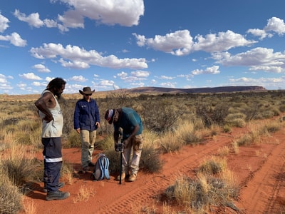 Ivan Wongawol, Jessica Chapman, and Clinton Farmer setting up camera.