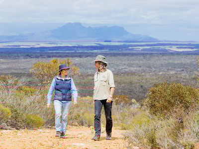 Bush Heritage ecologist Angela Sanders and Healthy Landscape Manager Simon Smale, with the Stirling Ranges in the background. Photo by William Marwick.