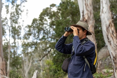 Joshua Wellington with binoculars.